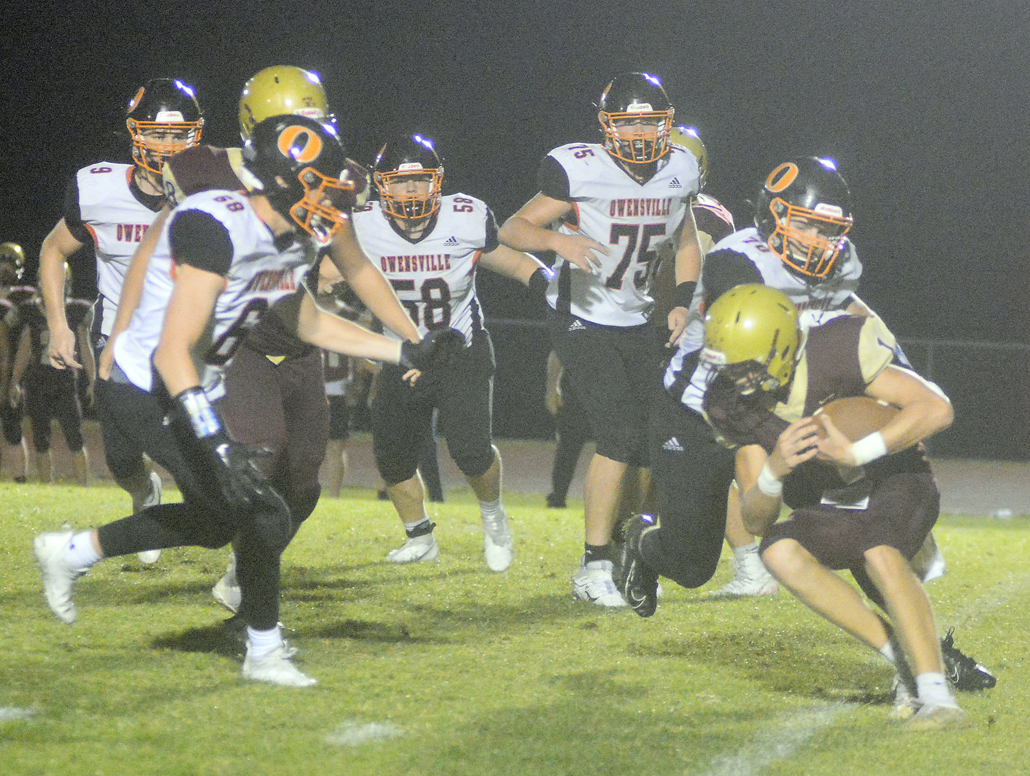 Helmig (far right) also got in on several defensive plays including the one shown below on the road at Eldon.